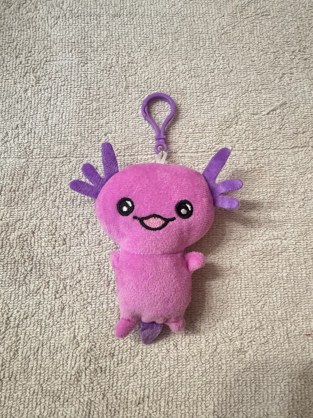 Pink axolotl plush keychain bag charm with purple gills and tail